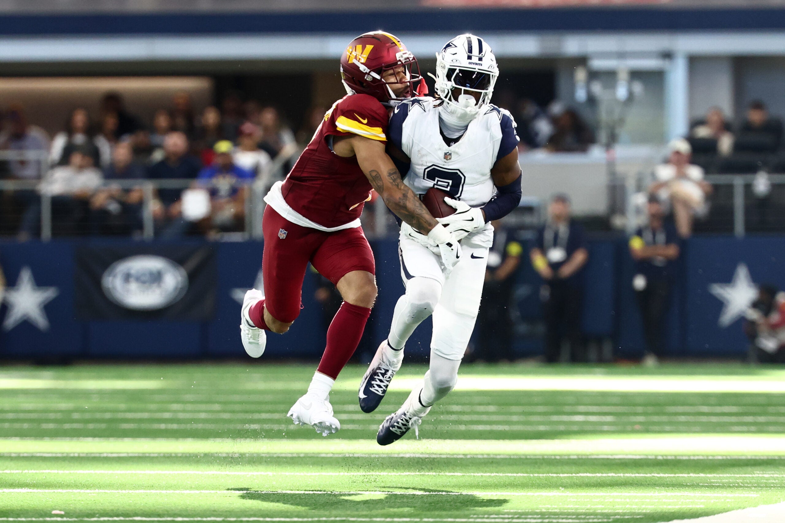 Oct 19, 2025; Arlington, Texas, USA; Dallas Cowboys wide receiver George Pickens (3) makes a reception defended by Washington Commanders cornerback Marshon Lattimore (2) during the second quarter of the game at AT&T Stadium.