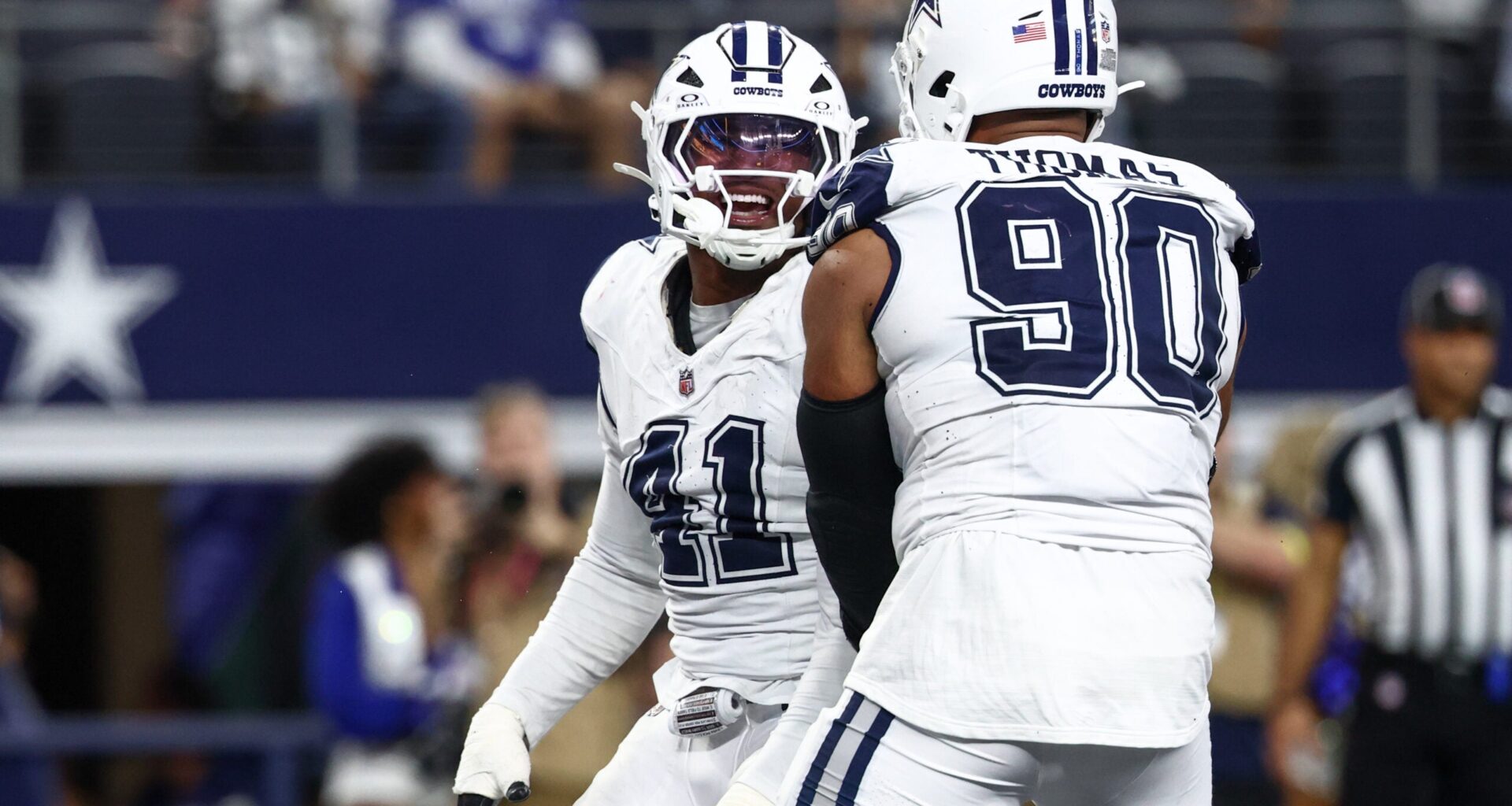 Oct 19, 2025; Arlington, Texas, USA; Dallas Cowboys defensive end Donovan Ezeiruaku (41) and defensive end Solomon Thomas (90) celebrate after a sack against the Washington Commanders during the fourth quarter of the game at AT&T Stadium.