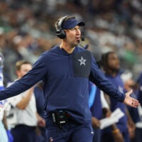 Nov 23, 2025; Arlington, Texas, USA; Dallas Cowboys head coach Brian Schottenheimer reacts during the third quarter against the Philadelphia Eagles at AT&T Stadium.