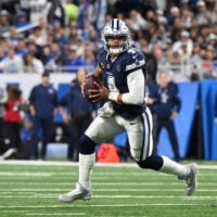 Dec 4, 2025; Detroit, Michigan, USA; Dallas Cowboys quarterback Dak Prescott (4) scrambles during the first half against the Detroit Lions at Ford Field.