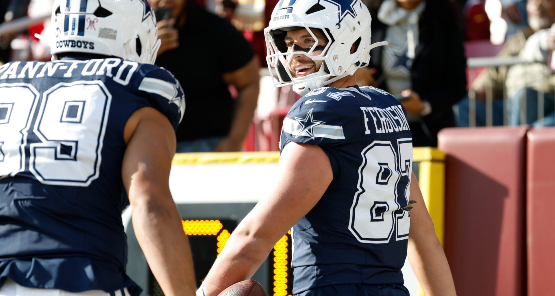 Dec 25, 2025; Landover, Maryland, USA; Dallas Cowboys tight end Jake Ferguson (87) celebrates after scoring a touchdown against the Washington Commanders in the first quarter at Northwest Stadium.