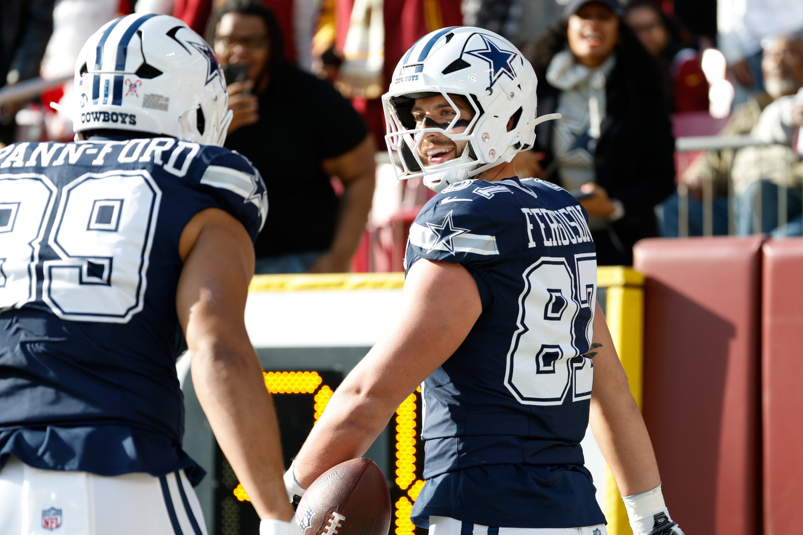 Dec 25, 2025; Landover, Maryland, USA; Dallas Cowboys tight end Jake Ferguson (87) celebrates after scoring a touchdown against the Washington Commanders in the first quarter at Northwest Stadium.