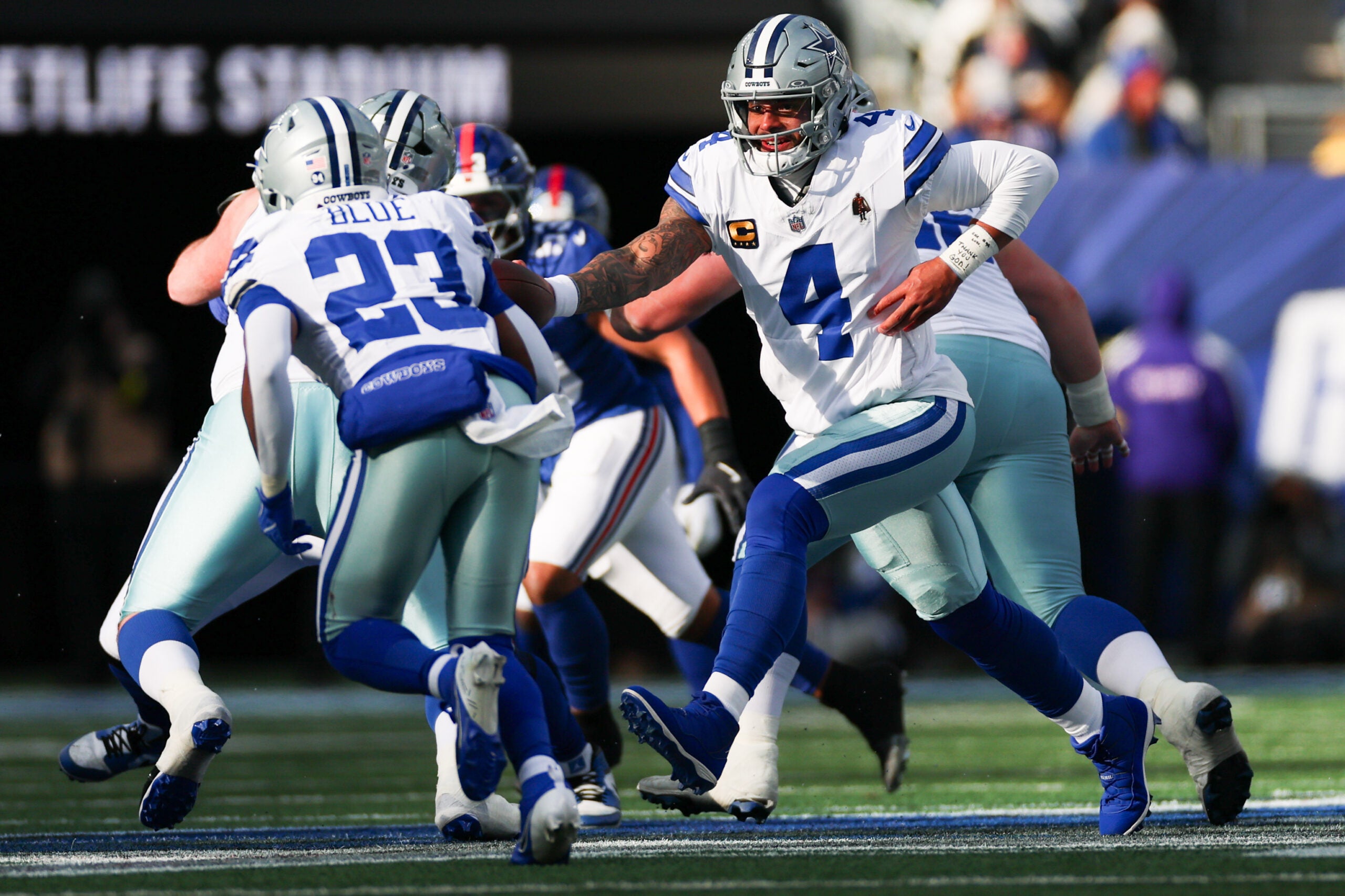 Jan 4, 2026; East Rutherford, New Jersey, USA; Dallas Cowboys quarterback Dak Prescott (4) hands the ball off to Dallas Cowboys running back Jaydon Blue (23) during the second quarter against the New York Giants at MetLife Stadium.