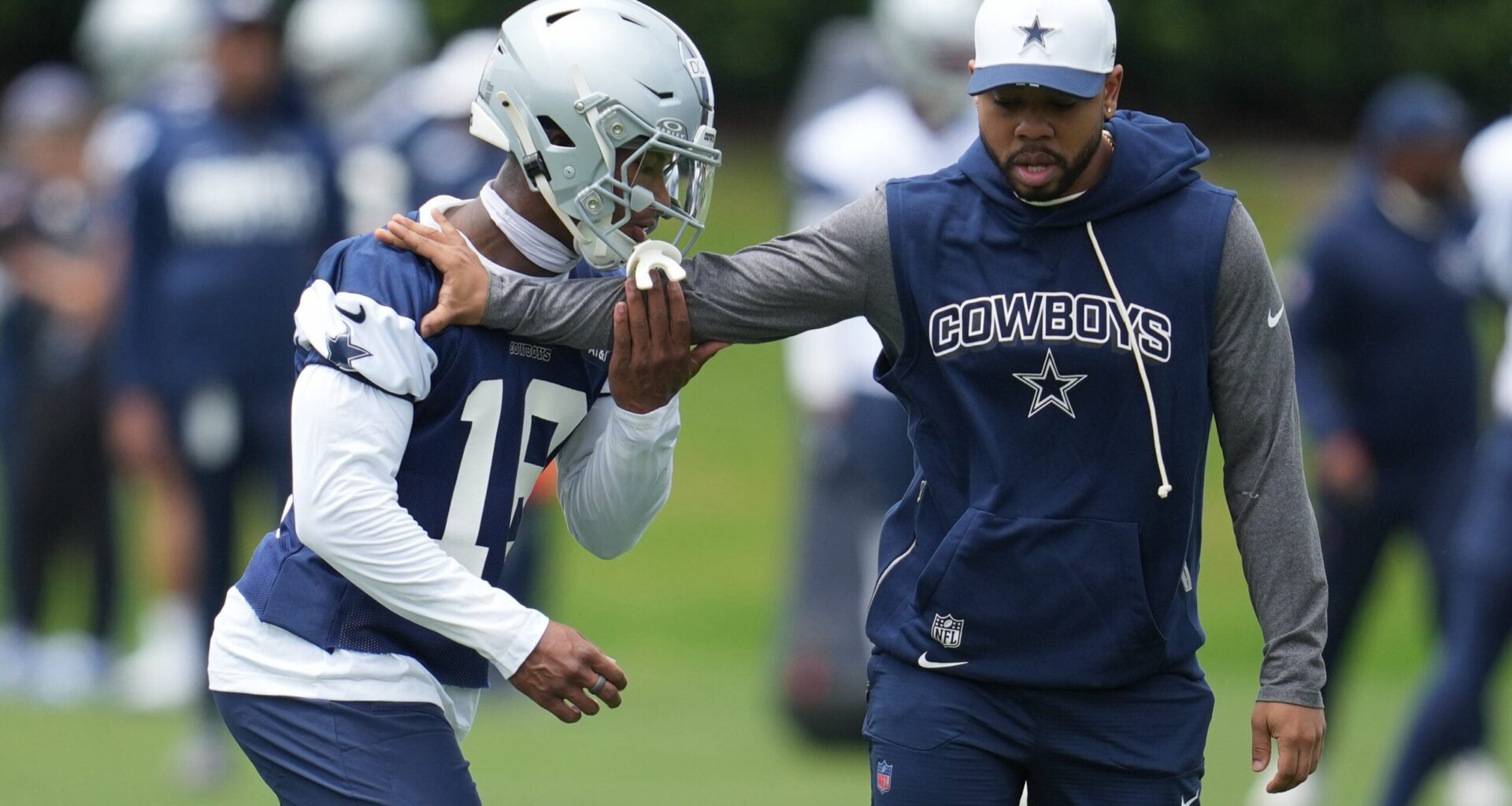 May 1, 2026; Frisco, TX, USA; Dallas Cowboys cornerback Caleb Downs (18) is coached through a drill with defensive coordinator Christian Parker at the Ford Center at the Star Training Facility in Frisco, Texas.