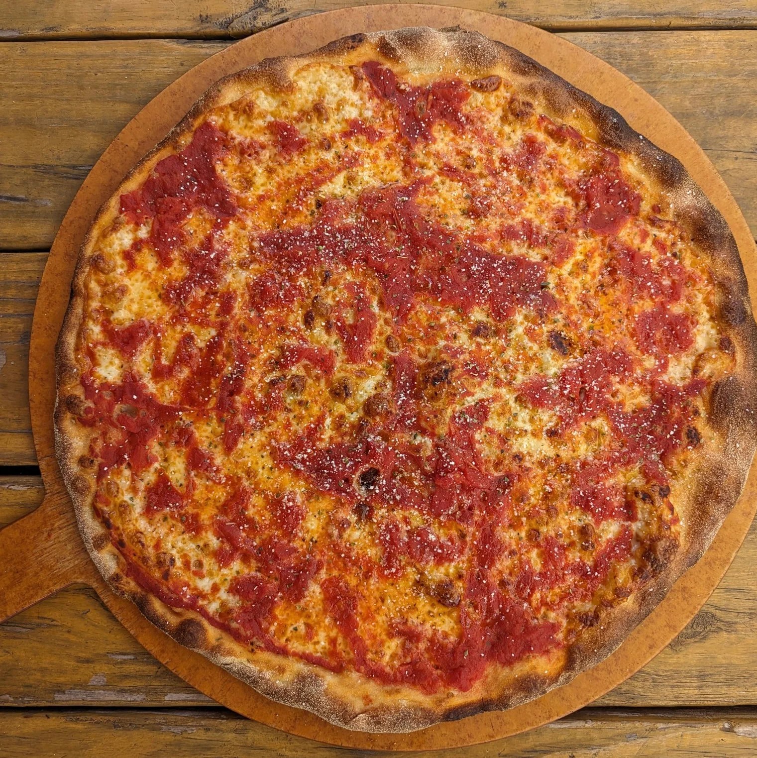 A circular shaped Trenton-style tomato pie from Pedroso’s Pizza.