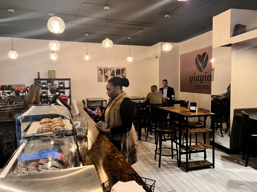 a customer ordering at yiayia's. 