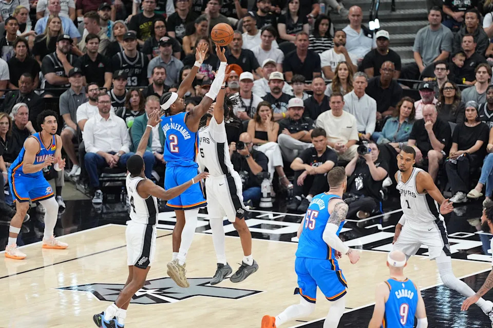 May 24, 2026; San Antonio, Texas, USA; Oklahoma City Thunder guard Shai Gilgeous-Alexander (2) shoots while defended by San Antonio Spurs guard De'Aaron Fox (4) and guard Stephon Castle (5) in the second quarter during game four of the western conference finals for the 2026 NBA playoffs at Frost Bank Center. Mandatory Credit: Daniel Dunn-Imagn Images