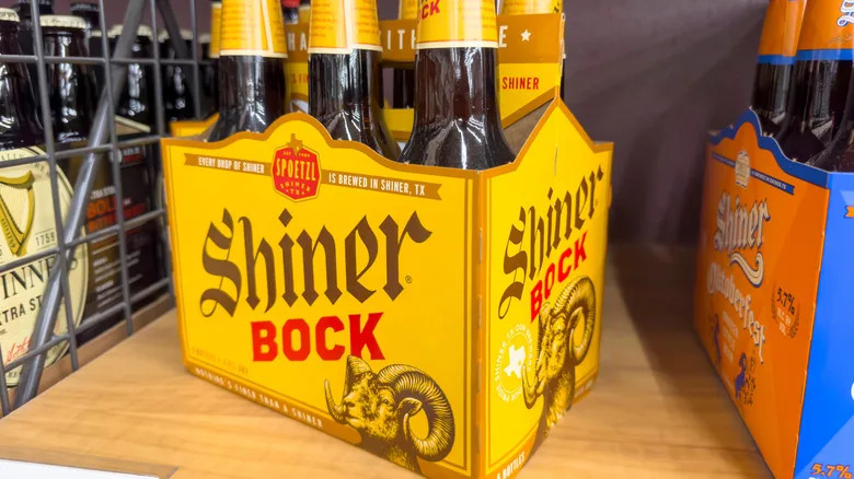 A six-pack of Shiner beer on a shelf.