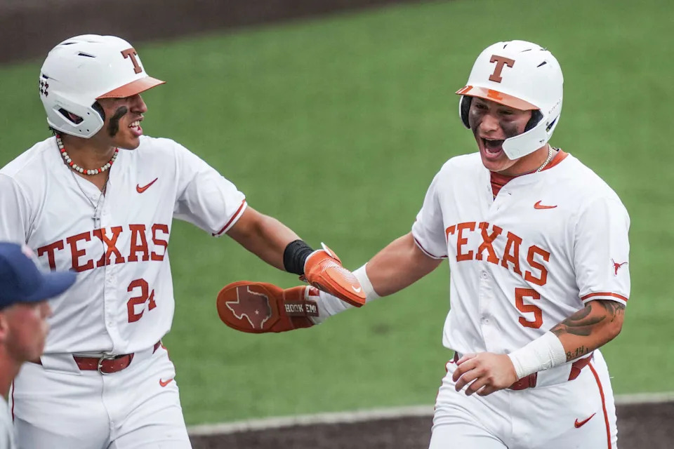 Texas Longhorns infielder Adrian Rodriguez (24) and infielder Ethan Mendoza (5) celebrate scoring in the first inning as the Texas Longhorns take on the UTSA Roadrunners at Disch-Falk Field in Austin, Tuesday, May 5, 2026. (Sara Diggins/Austin American-Statesman)