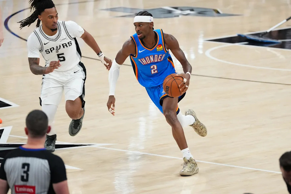 May 24, 2026; San Antonio, Texas, USA; Oklahoma City Thunder guard Shai Gilgeous-Alexander (2) drives the ball while defended by San Antonio Spurs guard Stephon Castle (5) in the first quarter during game four of the western conference finals for the 2026 NBA playoffs at Frost Bank Center. Mandatory Credit: Scott Wachter-Imagn Images