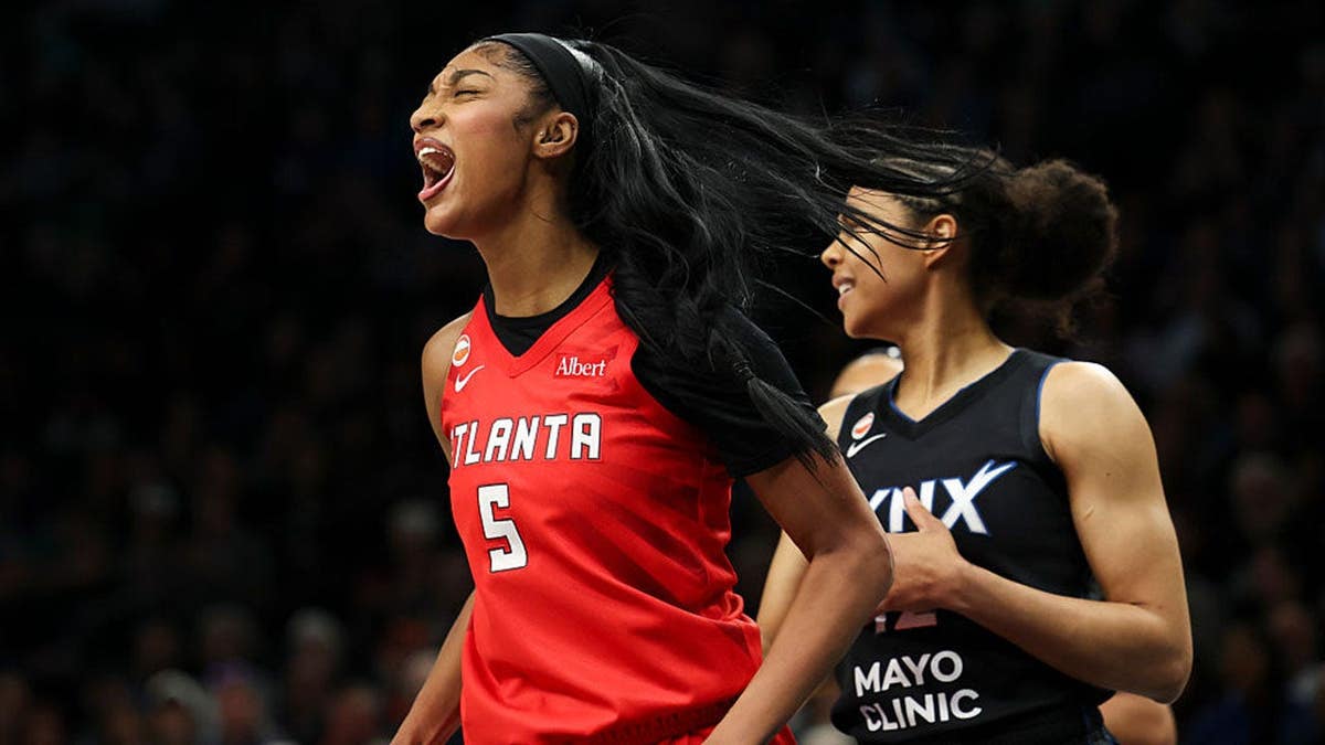 Angel Reese of the Atlanta Dream celebrates after scoring during a basketball game at Target Center.