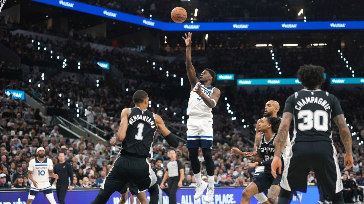 Minnesota Timberwolves SG Anthony Edwards shoots a floater over the San Antonio Spurs during Game 5 of their second-round series in the 2026 NBA Playoffs at Frost Bank Center in Texas.