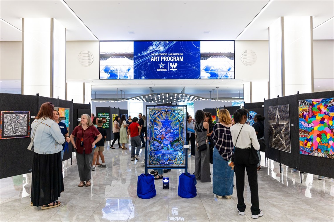 Wide show of artwork displayed on walls