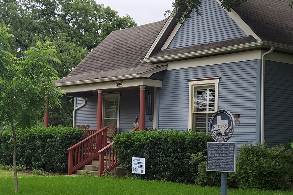 Sign in front of home that reads 