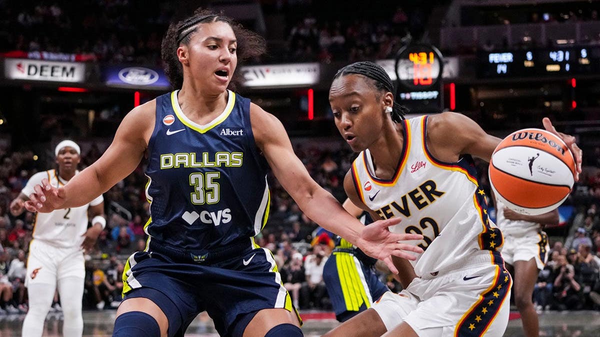 Dallas Wings guard Azzi Fudd guarding Indiana Fever guard Shatori Walker-Kimbrough on basketball court