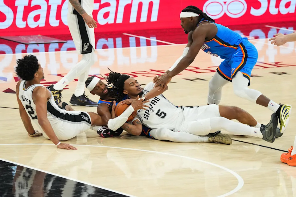 May 24, 2026; San Antonio, Texas, USA; San Antonio Spurs guard Dylan Harper (2), Oklahoma City Thunder guard Shai Gilgeous-Alexander (2), San Antonio Spurs guard Stephon Castle (5) and Oklahoma City Thunder forward Luguentz Dort (5), left to right, scramble for a loose ball in the second quarter during game four of the western conference finals for the 2026 NBA playoffs at Frost Bank Center. Mandatory Credit: Scott Wachter-Imagn Images
