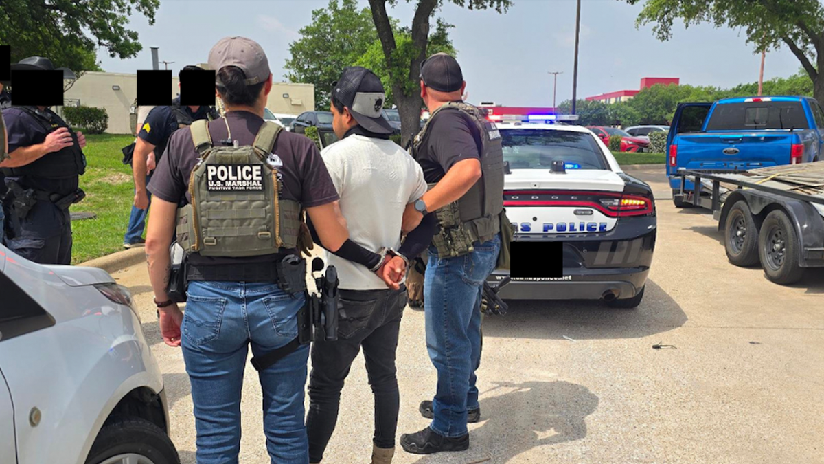 The suspected is handcuffed in this image from Luis Benitez-Gonzalez's arrest in Dallas by the Lone Star Fugitive Task Force