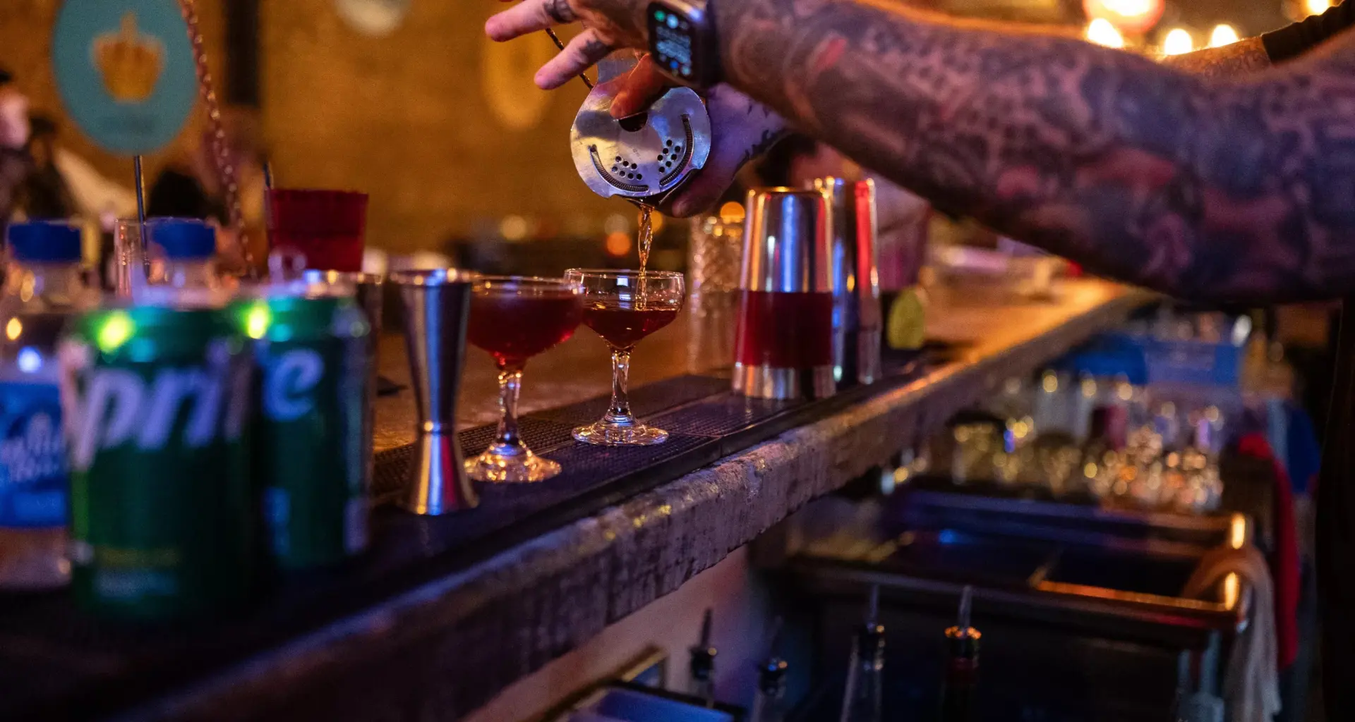 A bar tender pouring a drink