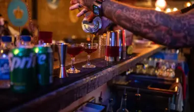 A bar tender pouring a drink