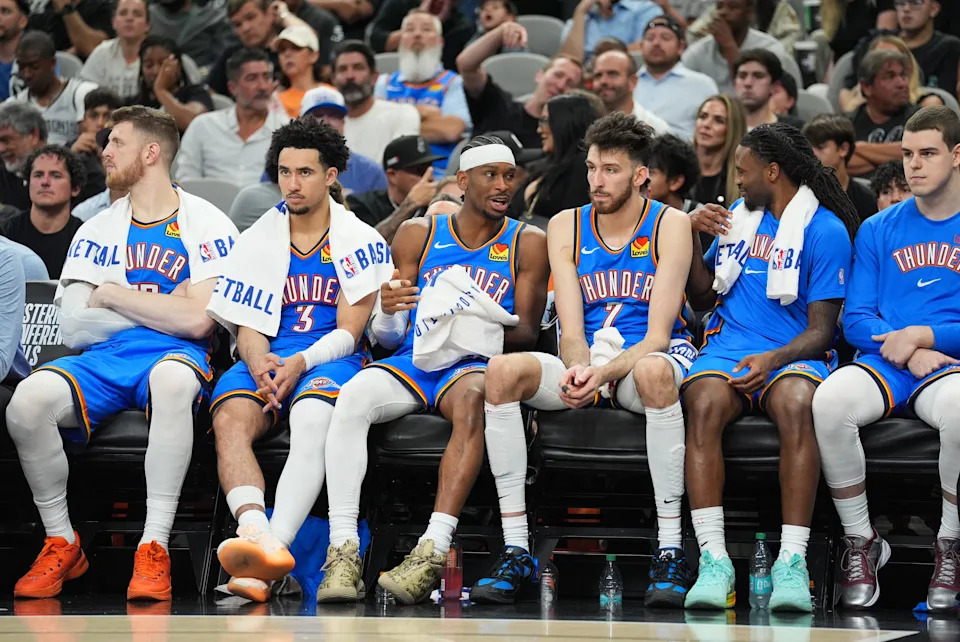 May 24, 2026; San Antonio, Texas, USA; Oklahoma City Thunder guard Shai Gilgeous-Alexander (2) exchanges words with center Chet Holmgren (7) on the bench in the fourth quarter against the San Antonio Spurs during game four of the western conference finals for the 2026 NBA playoffs at Frost Bank Center. Mandatory Credit: Daniel Dunn-Imagn Images