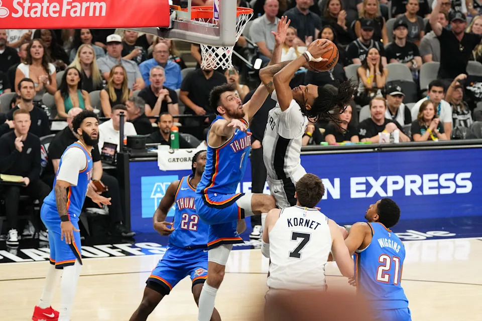 May 24, 2026; San Antonio, Texas, USA; San Antonio Spurs guard Stephon Castle (5) shoots while defended by Oklahoma City Thunder center Chet Holmgren (7) in the fourth quarter during game four of the western conference finals for the 2026 NBA playoffs at Frost Bank Center. Mandatory Credit: Scott Wachter-Imagn Images