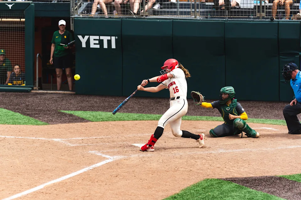 Wisconsin softball player Hannah Conger hits a walk-off double in the ninth inning of the Badgers' extra-inning win over Baylor on May 15 in the first round of the NCAA Tournament in Austin, Texas.