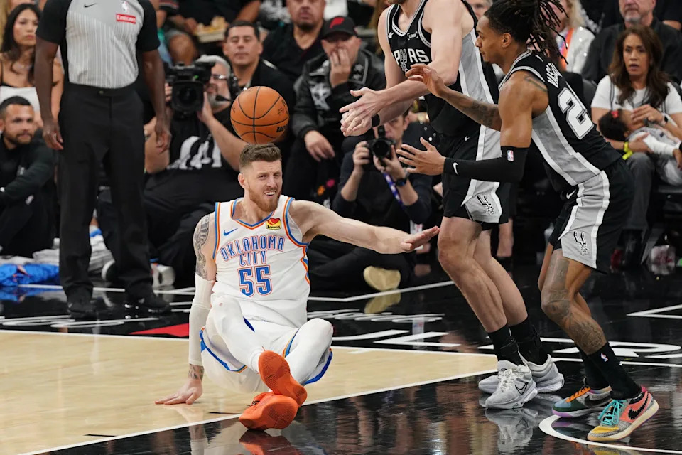 May 28, 2026; San Antonio, Texas, USA; Oklahoma City Thunder center Isaiah Hartenstein (55) and San Antonio Spurs guard Devin Vassell (24) attempt to get a loose ball in the second half during game six of the western conference finals for the 2026 NBA playoffs at Frost Bank Center. Mandatory Credit: Dustin Safranek-Imagn Images