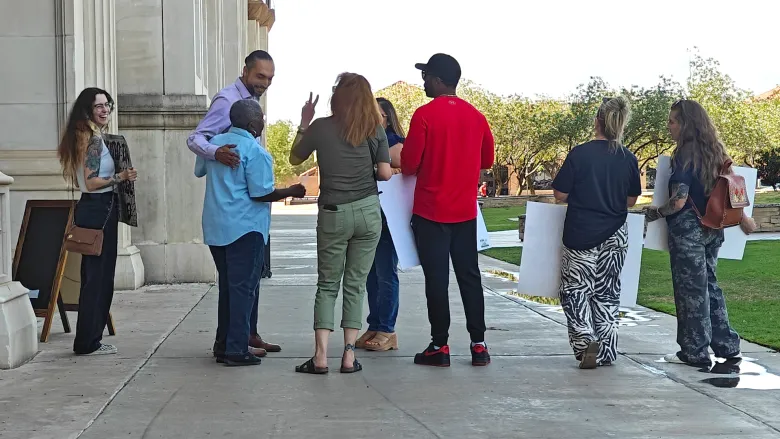 Protestors outside an AI data center discussion in Lubbock, Texas. 