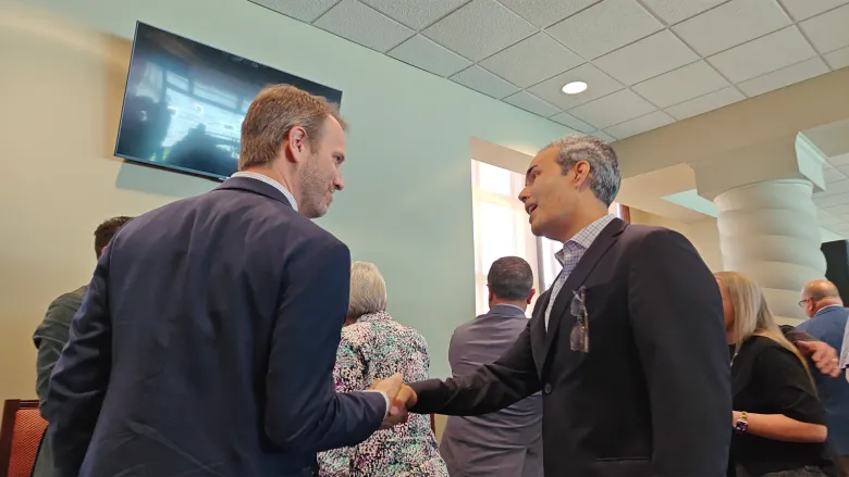 Matthew Watkins and George P. Bush at an AI data center discussion in Lubbock, Texas.