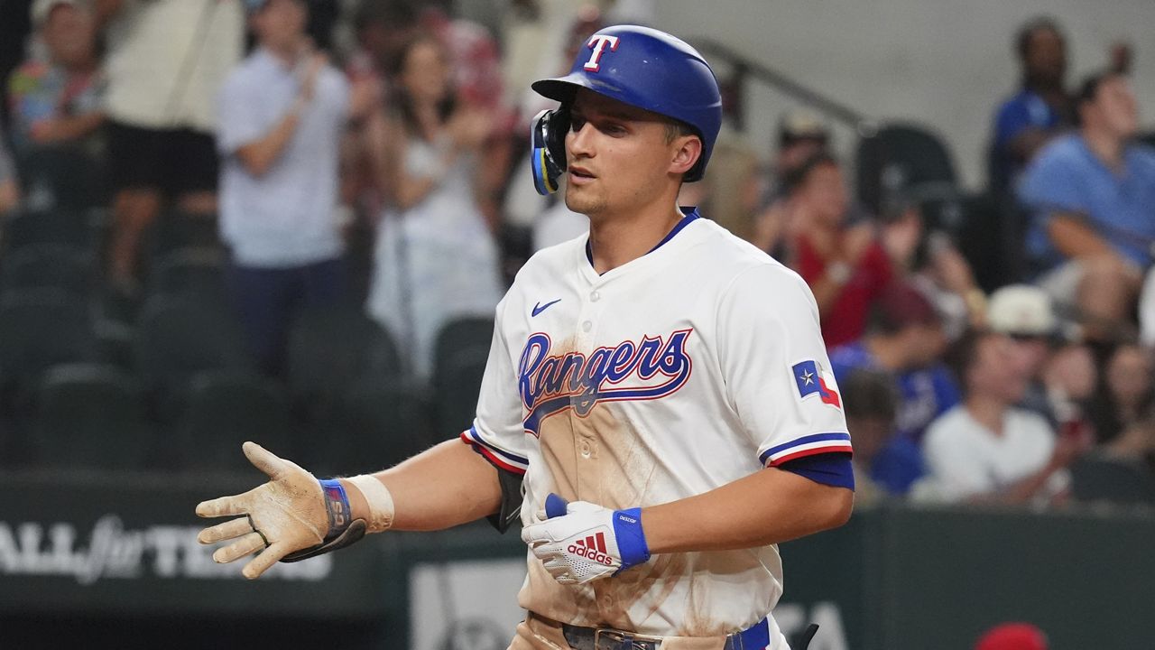 Texas Rangers' Corey Seager runs home after hitting a home run during the seventh inning of a baseball game against the Athletics, Tuesday, July 22, 2025, in Arlington, Texas. (AP Photo/LM Otero)