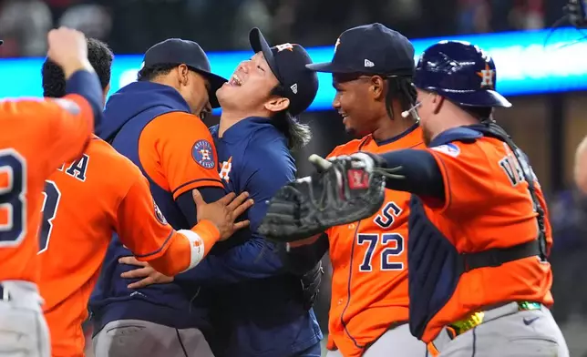 Houston Astros starting pitcher Tatsuya Imai, center, celebrates with teammates, including pitcher Alimber Santa (72) and catcher Christian V·zquez, right, after the team combined for a no-hitter against the Texas Rangers during a baseball game Monday, May 25, 2026, in Arlington, Texas. (AP Photo/Julio Cortez)