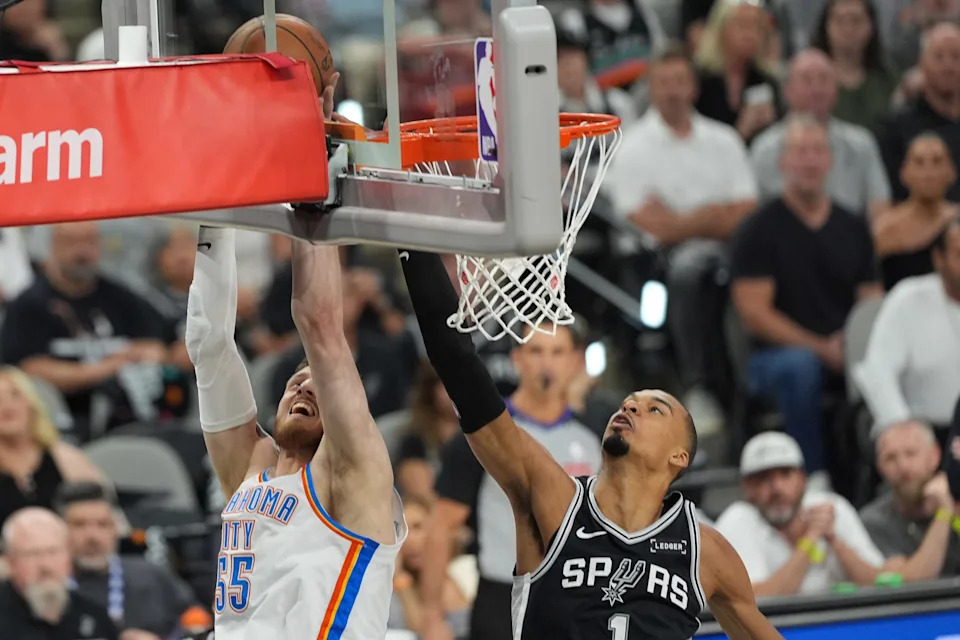 May 28, 2026; San Antonio, Texas, USA; Oklahoma City Thunder center Isaiah Hartenstein (55) shoots the ball past San Antonio Spurs forward Victor Wembanyama (1) in the first half during game six of the western conference finals for the 2026 NBA playoffs at Frost Bank Center. Mandatory Credit: Daniel Dunn-Imagn Images