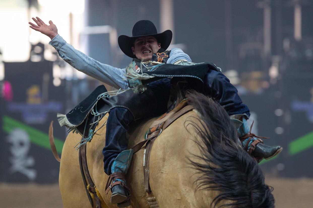 Jayco Roper, of Oktana, Oklahoma, rides Gun Powder during the bareback riding portion of the annual Buc Days Rodeo in Corpus Christi on May 9, 2025.