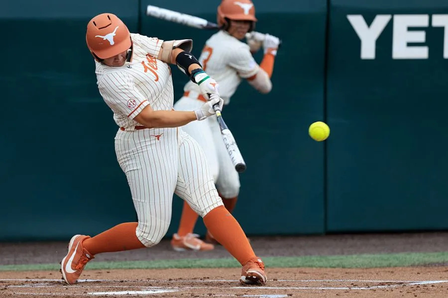 AUSTIN, TX – APRIL 12: Texas Longhorns utility Katie Stewart (20) gets a hit during the SEC college softball game between Texas Longhorns and Oklahoma Sooners on April 12, 2026, at Red & Charline McCombs Field in Austin, Texas. (Photo by Adam Davis/Icon Sportswire via Getty Images)