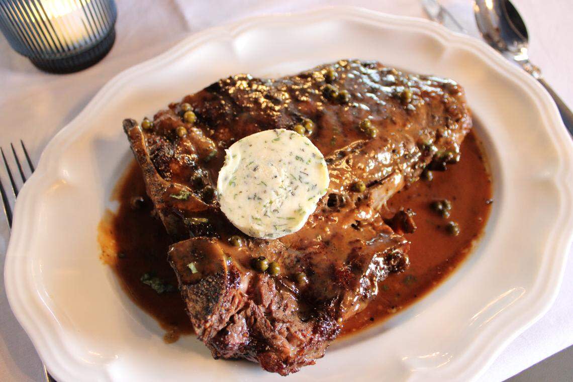 The 32-ounce bone-in porterhouse steak is served with a green peppercorn sauce, herb butter and is carved table-side at Theodore’s Steak and Seafood.