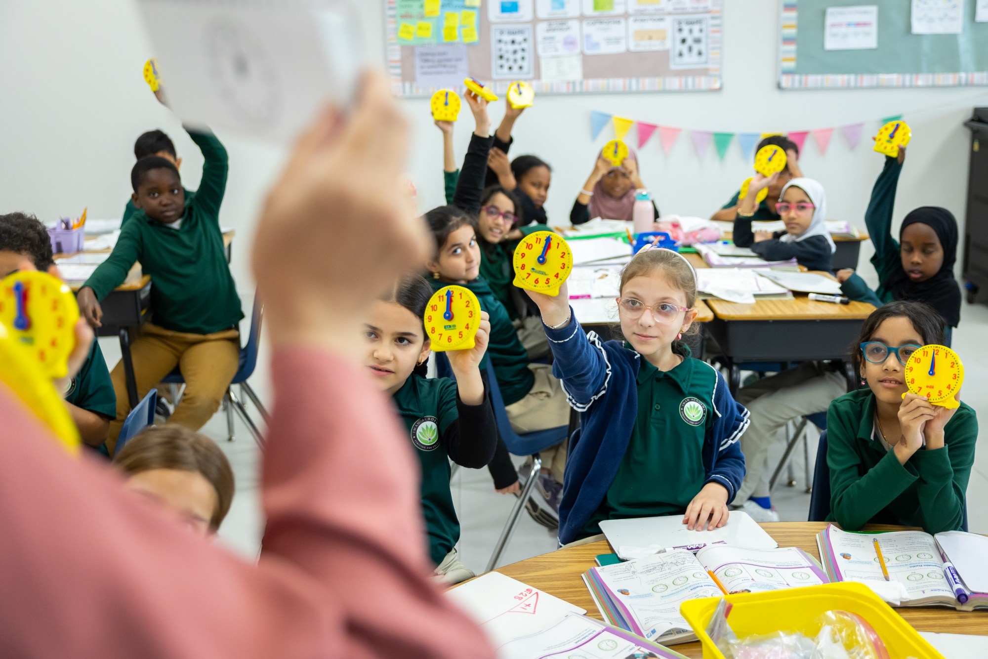 Students translate digital time to analog clocks at Iman Academy on Wednesday, March 4, 2026, in southwest Houston.