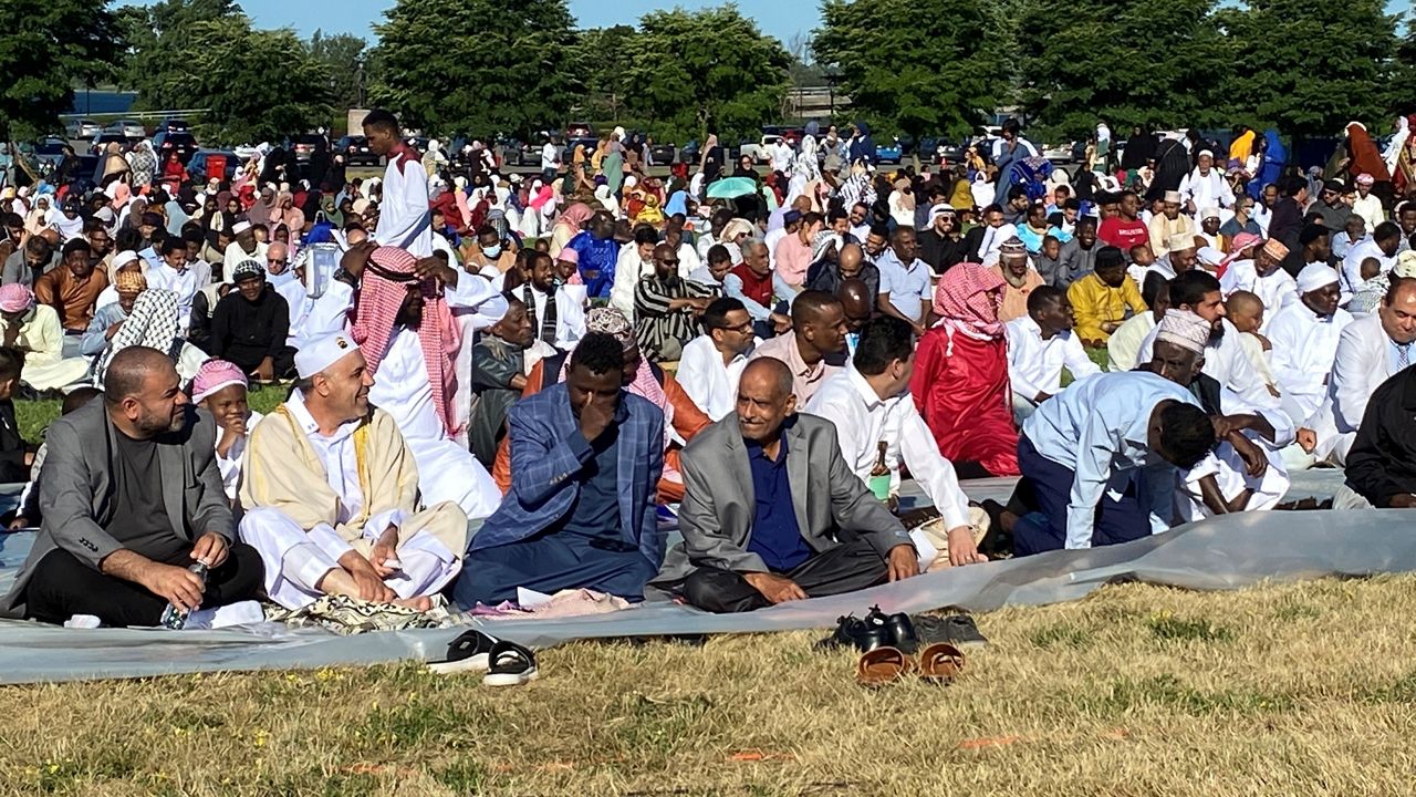 People gather for an Eid al-Adha event. (Spectrum News)