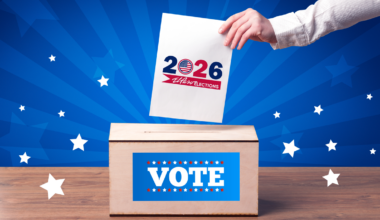 An illustration of a hand putting a 2026 ballot into a ballot box.