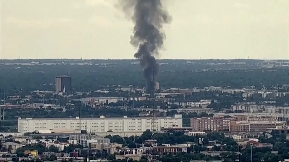 Flames engulf an apartment complex after an explosion in the Oak Cliff area of Dallas on Thursday as Dallas Fire-Rescue crews battled the blaze. Four people were hospitalized, according to reports. (KDFW FOX 4 via AP)