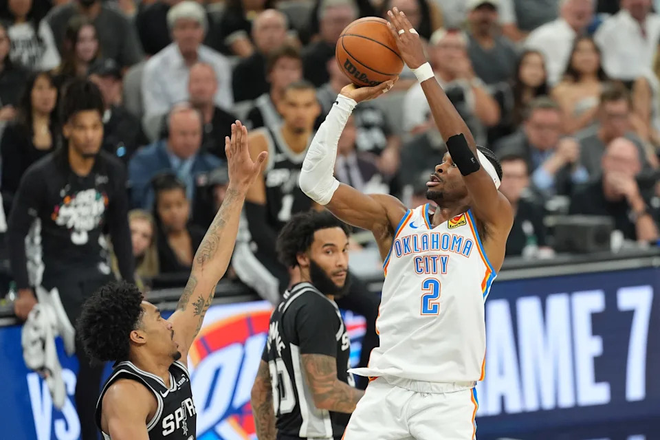 May 28, 2026; San Antonio, Texas, USA; Oklahoma City Thunder guard Shai Gilgeous-Alexander (2) shoots the ball past San Antonio Spurs guard Dylan Harper (2) in the first half during game six of the western conference finals for the 2026 NBA playoffs at Frost Bank Center. Mandatory Credit: Daniel Dunn-Imagn Images