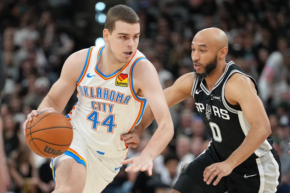 May 28, 2026; San Antonio, Texas, USA;Oklahoma City Thunder guard Nikola Topic (44) dribbles the ball past San Antonio Spurs guard Jordan McLaughlin (0) in the second half during game six of the western conference finals for the 2026 NBA playoffs at Frost Bank Center. Mandatory Credit: Daniel Dunn-Imagn Images