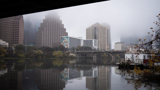 AUSTIN, TEXAS - JANUARY 23: Fog hangs over the Austin skyline as rain arrives in the Austin area on Friday, Jan. 23, 2025