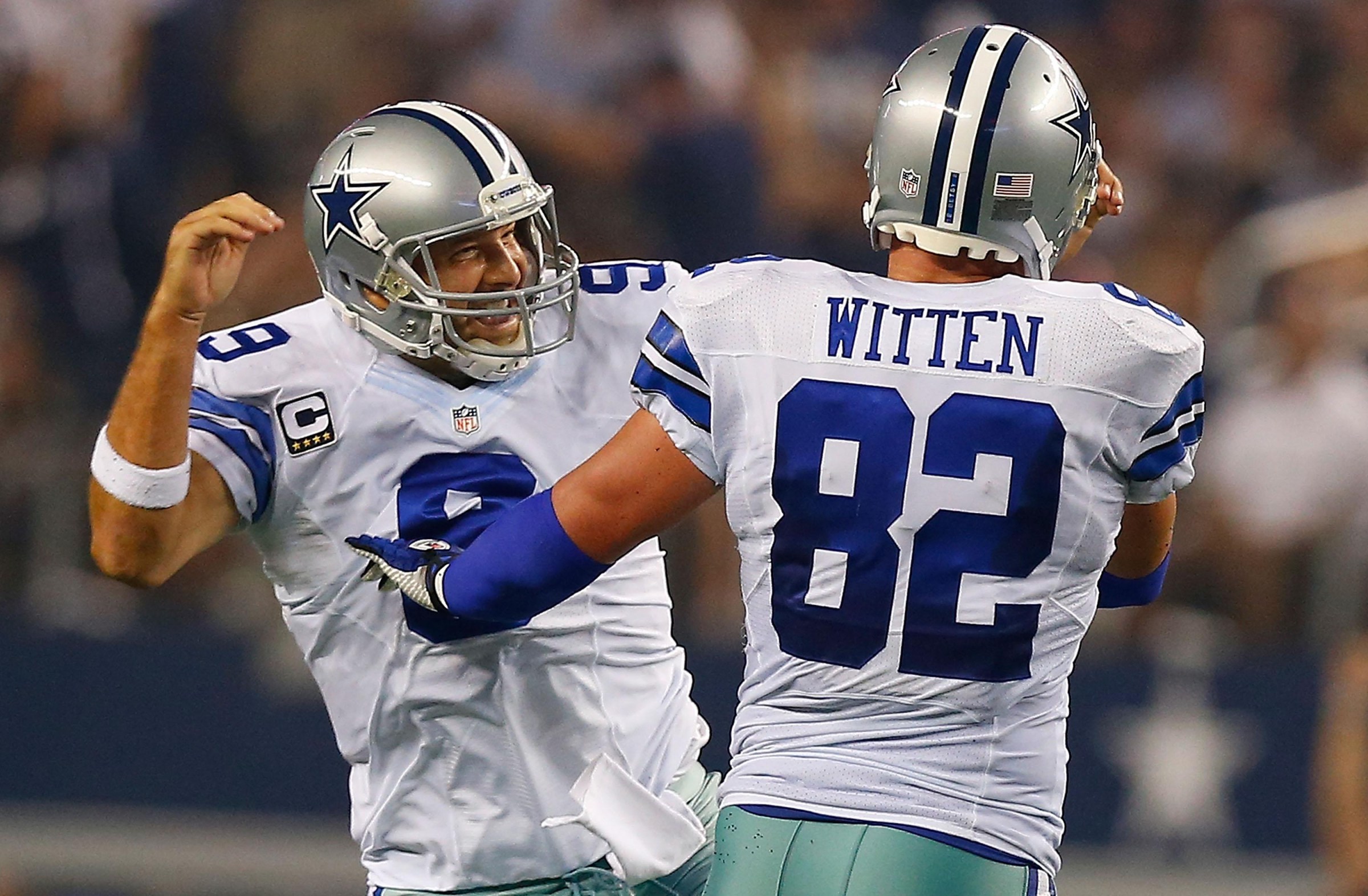 ARLINGTON, TX - SEPTEMBER 28: Tony Romo #9 of the Dallas Cowboys and Jason Witten #82 of the Dallas Cowboys celebrate after scoring a touchdown against the New Orleans Saints in the first half at AT&T Stadium on September 28, 2014 in Arlington, Texas. (Photo by Tom Pennington/Getty Images)