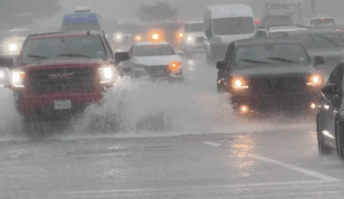 Drivers Push Through Flooded Road in Houston Suburbs
