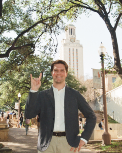 image of a student standing in front of the UT tower