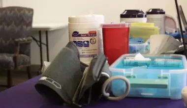 Health care supplies, including a blood pressure cuff and wipes.