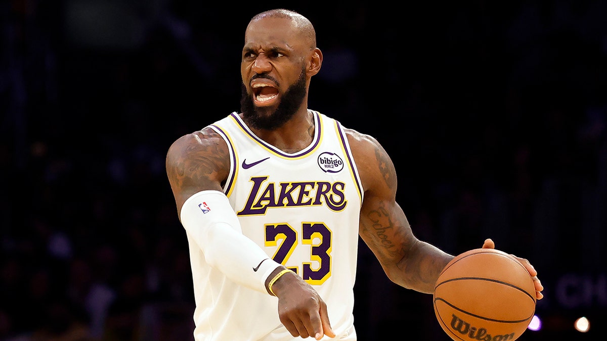 LeBron James controlling the basketball during a game at Crypto.com Arena