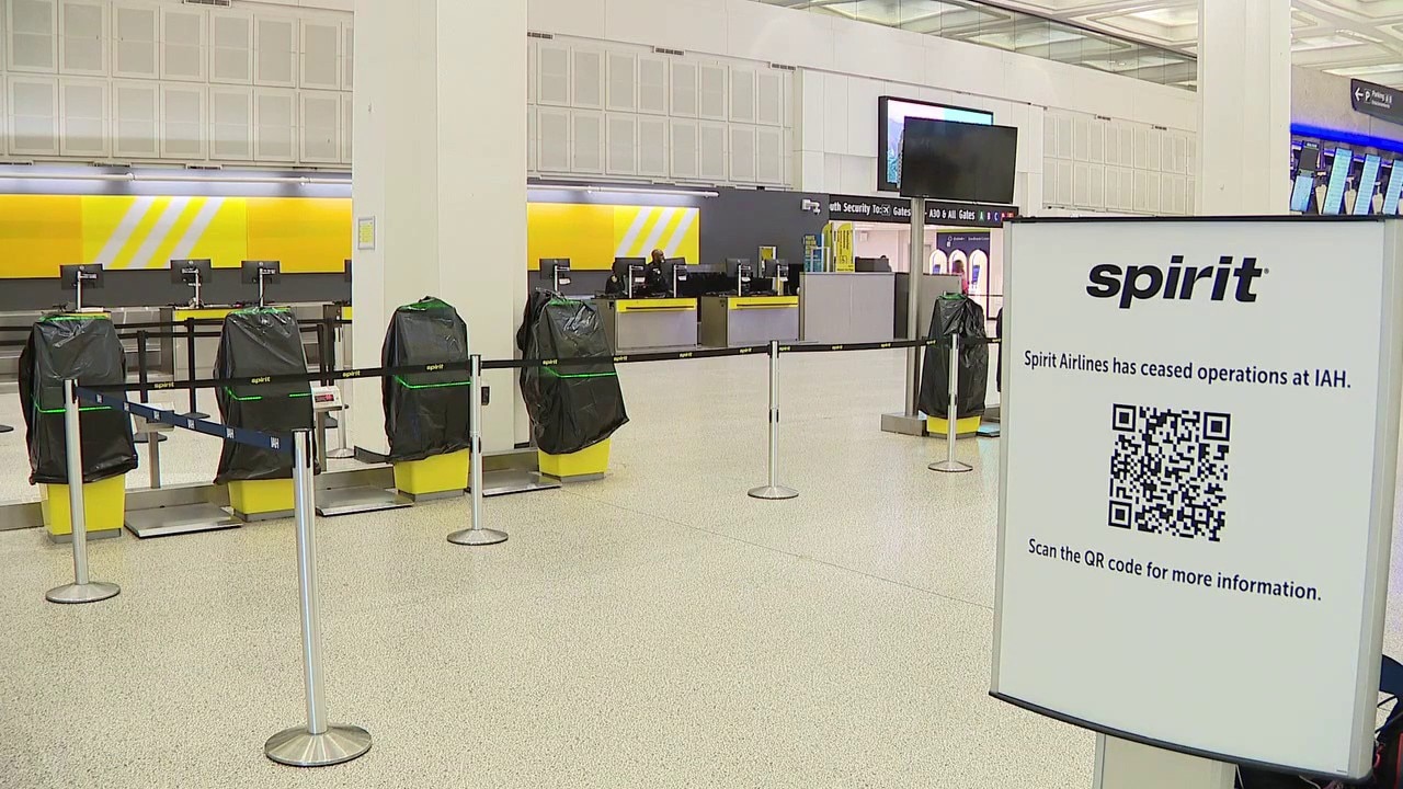 FILE – Spirit flight attendant stuck in Houston after airlines shuts down