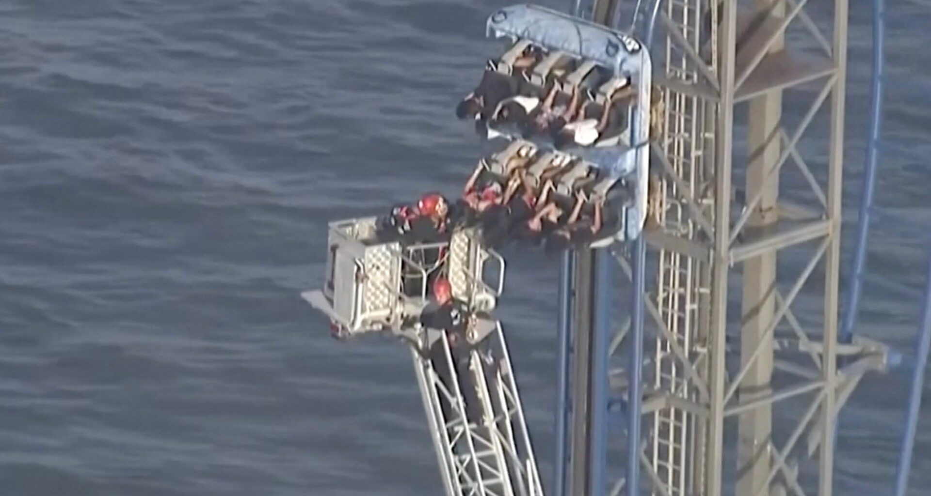 Firefighters work to free riders stuck atop a rollercoaster in Texas | News