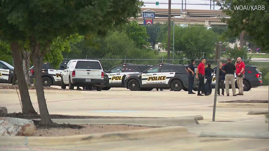 Police vehicles are parked at the scene of a vehicle fire in San Antonio, Texas, where two children were found dead inside the car May 15, 2026.